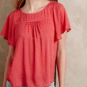Maeve Coral Dotted blouse with flutter sleeves.