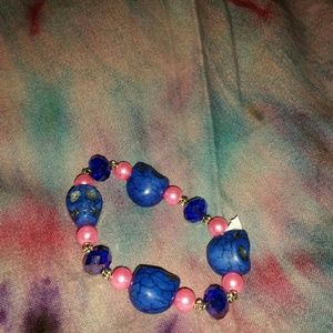 Stretchy hand made blue beaded skull bracelet