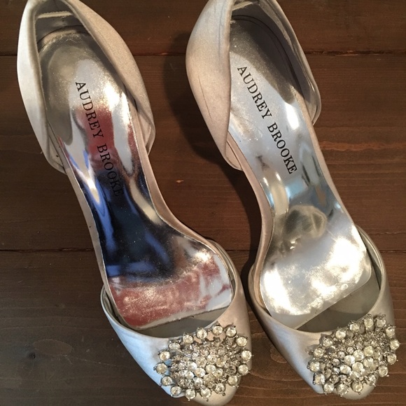 Audrey Brooke silver pumps with medallion