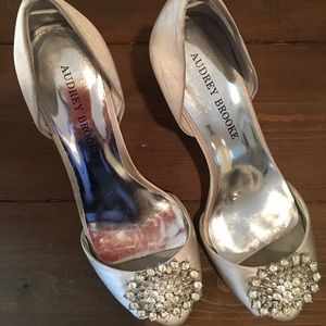 Audrey Brooke silver pumps with medallion