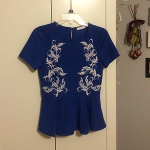 Blue embroidered peplum top from Modcloth
