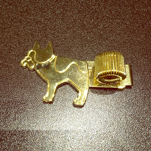 brand new doggy brooch can hold a pen.