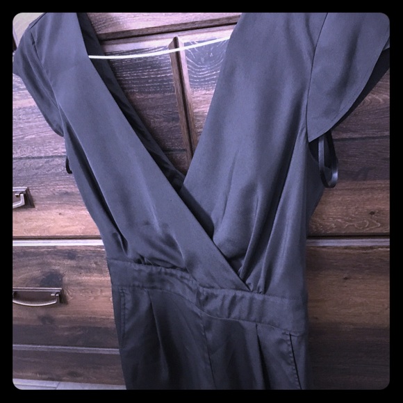 Tie back romper. Worn once and dry cleaned.
