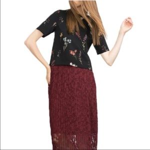 New. Pretty floral chiffon top.