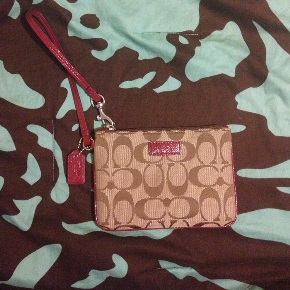 Coach wristlet with cranberry accent colors