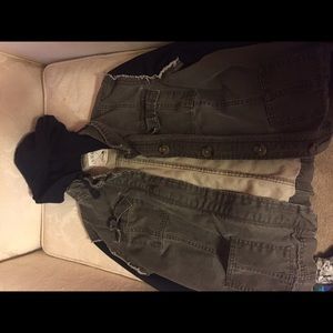 Military vest with black sleeves and hood