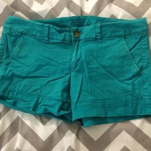 Teal shorts with marbled button