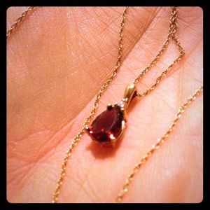 14k gold necklace with garnet stone