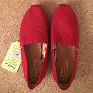 Brand new red TOMs size 7.5