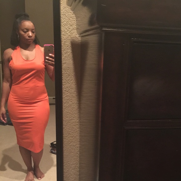 Super sexy orange cutout, bodycon dress.