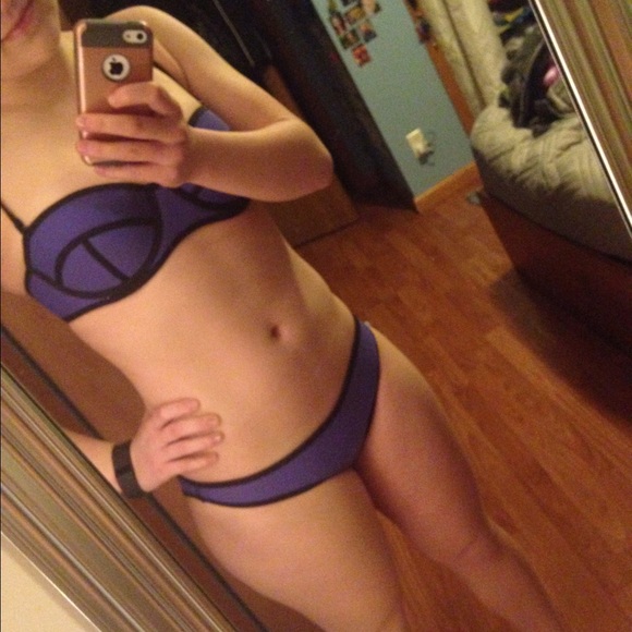 Two piece purple suit, new, never worn in water