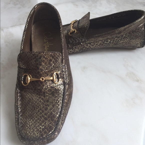 Cole Haan metallic gold driving shoes.