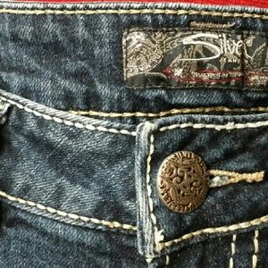 Intentional distressed look Silver jeans