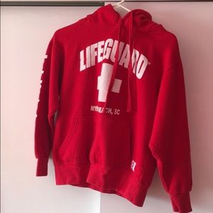 Red lifeguard sweater