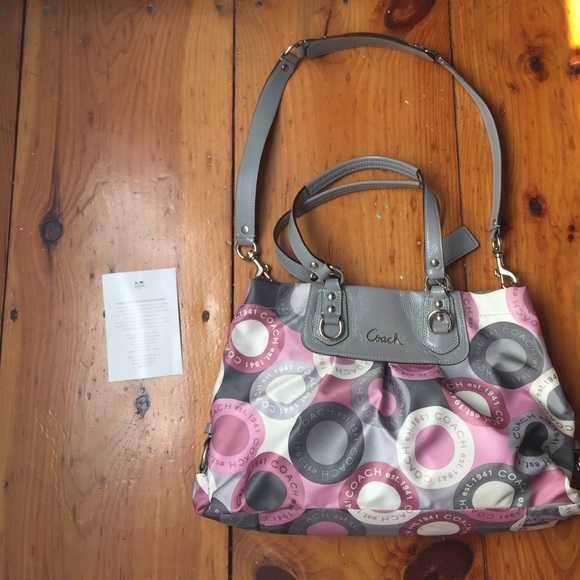White, gray, and pink coach purse.