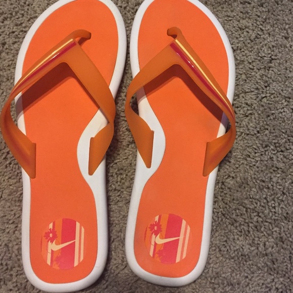 orange nike flip flops
