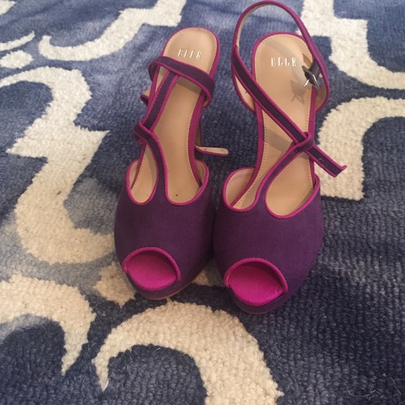 Brand new never worn Purple Elle heels .