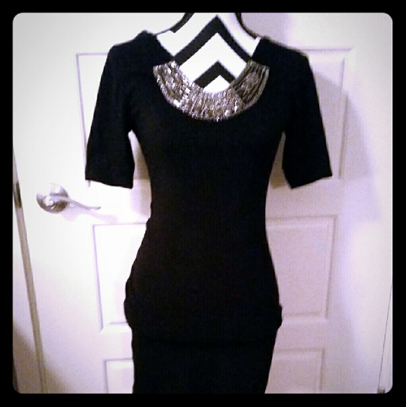 Black fitted midi dress with jeweled neckline