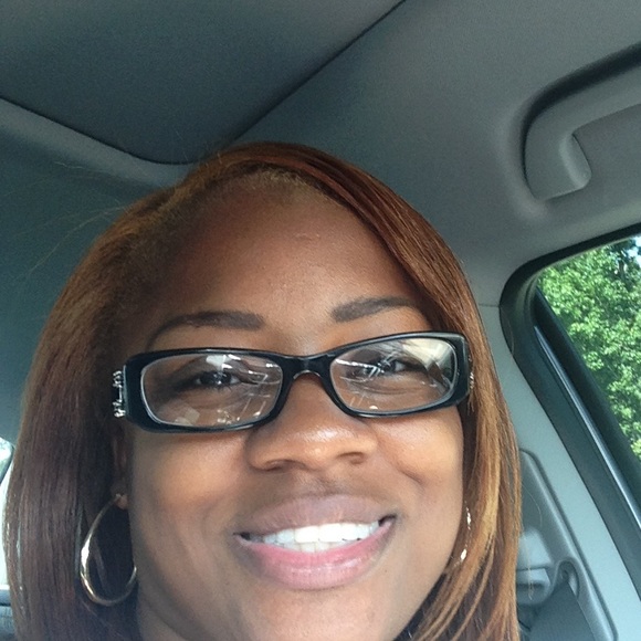 Black eyeglass frames with side lense decoration.