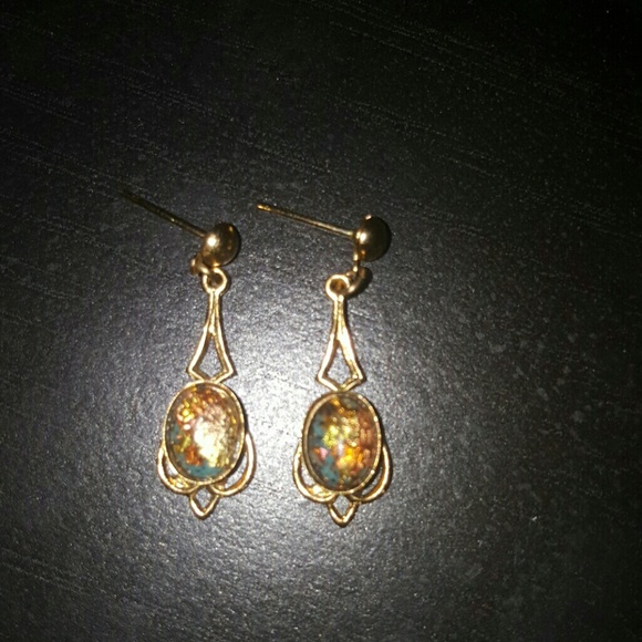Gold earrings with mystical topaz