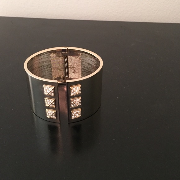VS gold studded bracelet.
