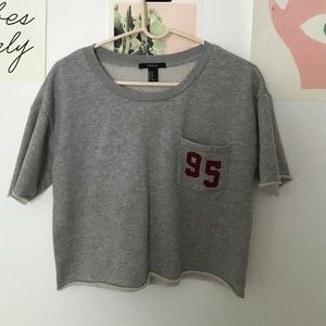 Cropped sweat shirt with pocket that's says 95