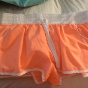 Short peach colored swimming shorts