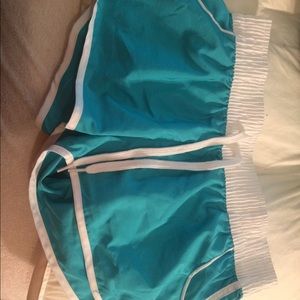 Short teal colored swimming shorts