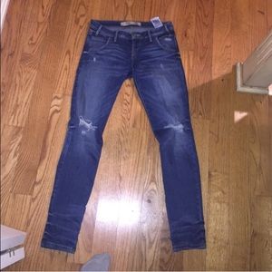 Medium blue distressed skinny low rise GUESS jeans