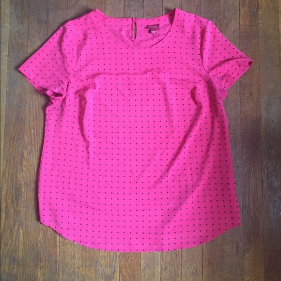 Pink blouse with polka dots.