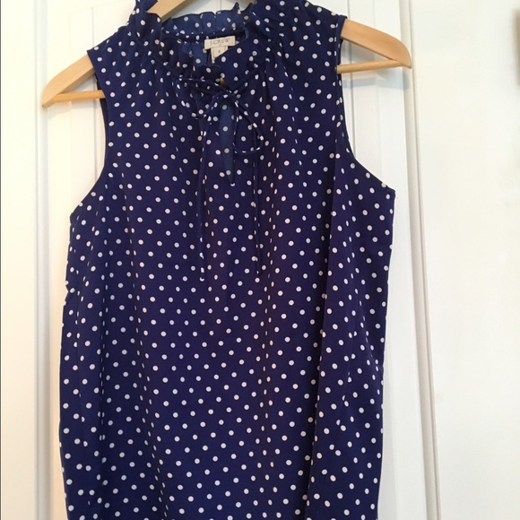 Polka dot sleeveless top with tie & ruffle detail