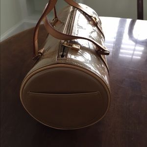 Louis Vuitton barrel roll bag