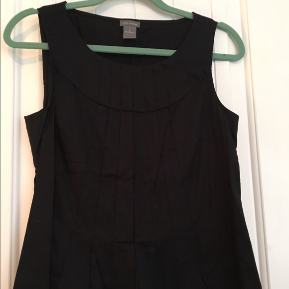 Black sleeveless top with pleated detailing