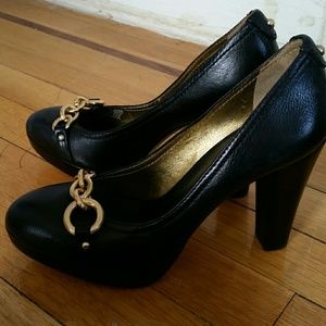 Black pumps with gold embellishment