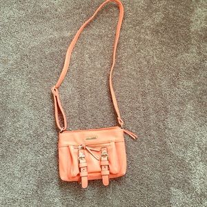 Small coral cross body bag.