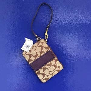 Coach brown & plum wristlet.