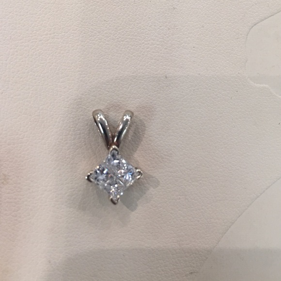 14K white gold and 1 carat diamond quad pendant.