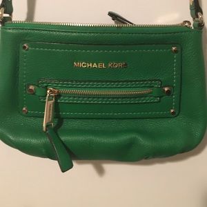 Never used green MK cross body purse.