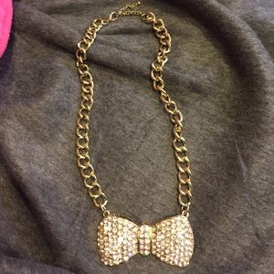 Bow tie necklace.