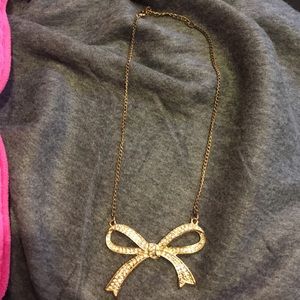 Bow necklace.