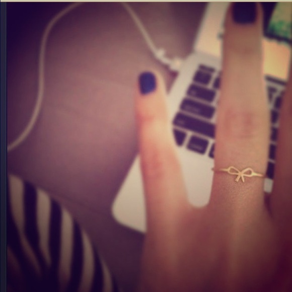 Dogeared small bow ring.