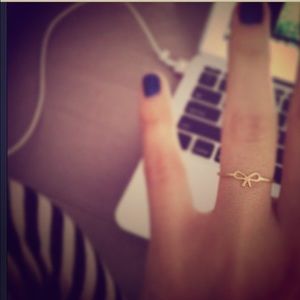 Dogeared small bow ring.