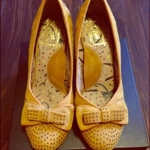 Anthropologie bow heels mustard with sequins.