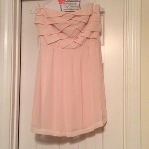 Blush pleated strapless dress