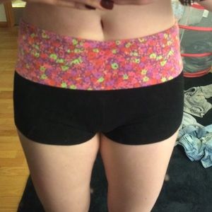 Black spandex yoga shorts with floral fold over