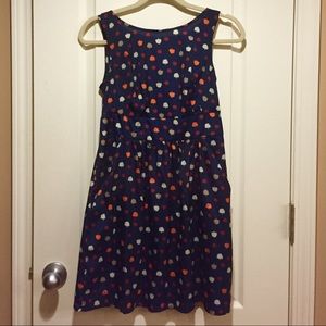 Navy dress with multicolored trees, with pockets.