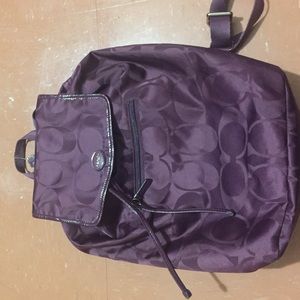 Coach sling backpack.