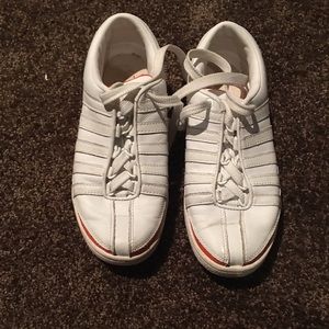 Orange and white K-Swiss tennis shoes