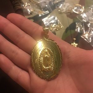 18k laminated gold Virgen De Guadalupe pendant.