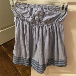 A strapless light blue and white striped shirt